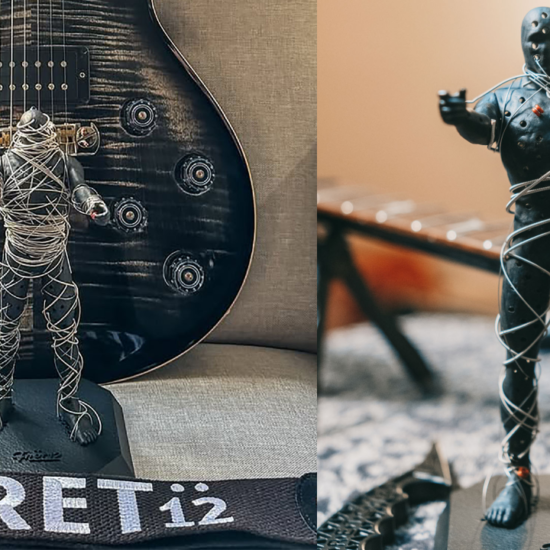 String Thing mummy figurine wrapped in recycled guitar strings displayed in front of an electric guitar.