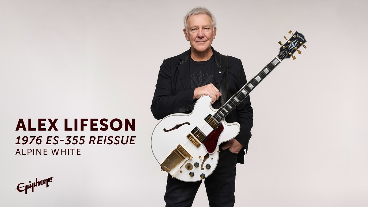 A photo of Rush guitarist Alex Lifeson holding the Epiphone IGC Alex Lifeson 1976 ES-355 Reissue