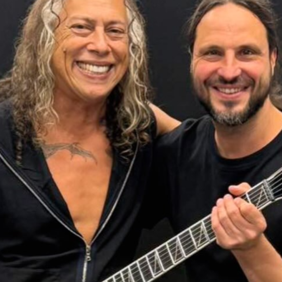 A photo of Kirk Hammett holding Gojira guitarist Christian Andreu's brand-new Pro Plus Series signature model