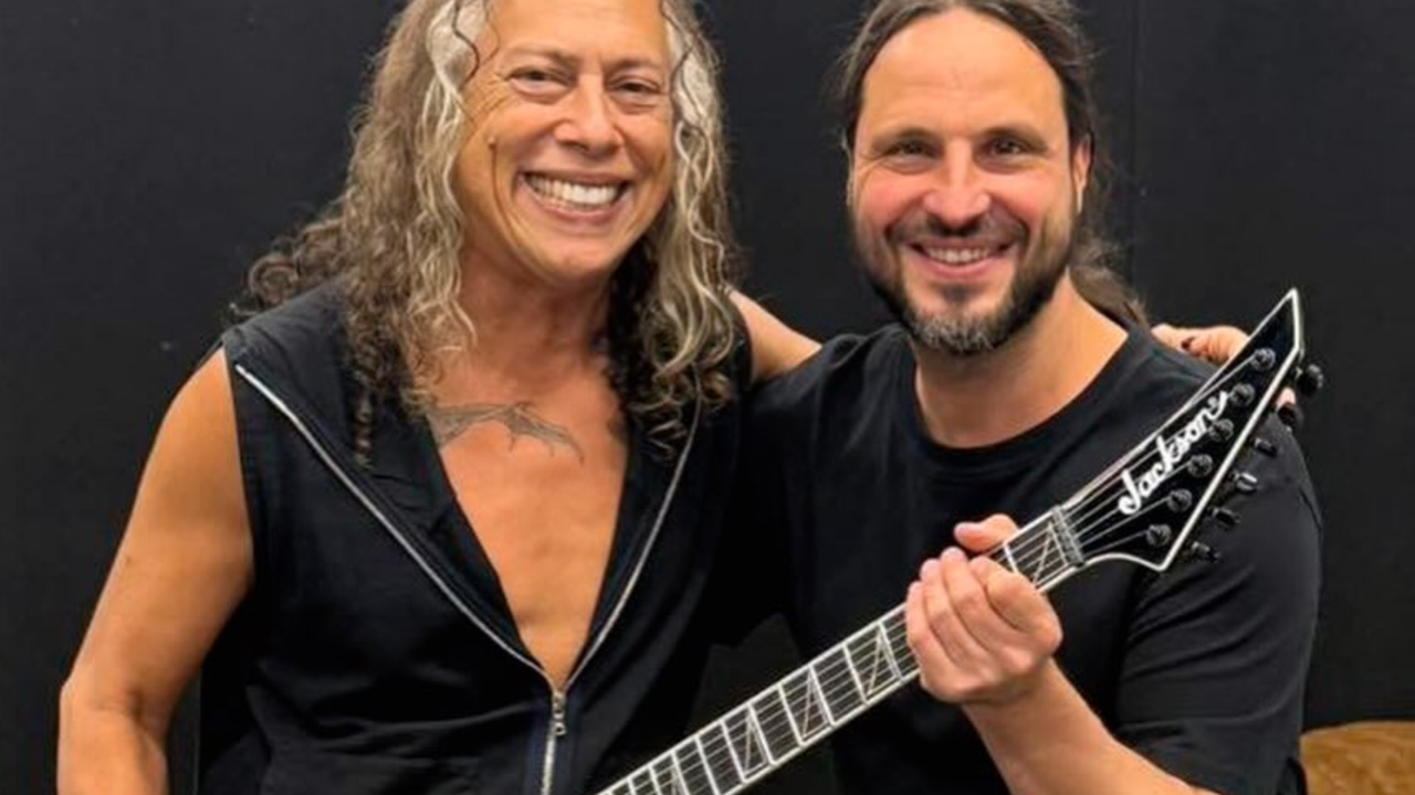 A photo of Kirk Hammett holding Gojira guitarist Christian Andreu's brand-new Pro Plus Series signature model