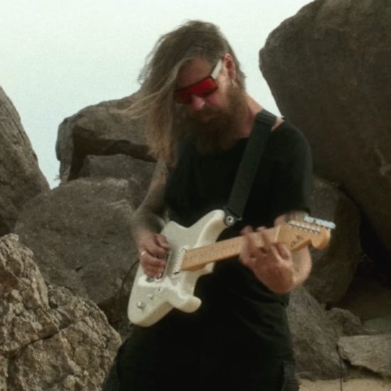 A photo of Slipknot guitarist Jim Root playing the Charvel American Neo-Classic SD-1