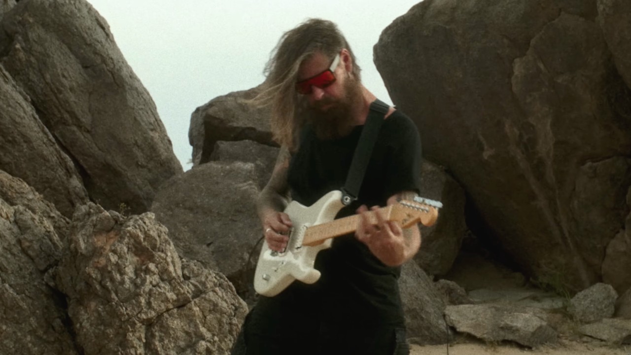 A photo of Slipknot guitarist Jim Root playing the Charvel American Neo-Classic SD-1